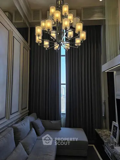 Luxurious living room with elegant chandelier and city view