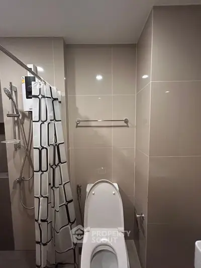Modern bathroom with sleek tiles and shower curtain