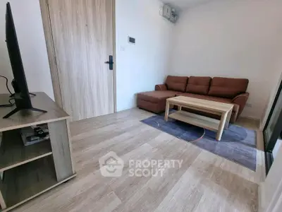 Modern living room with cozy sofa and sleek TV setup