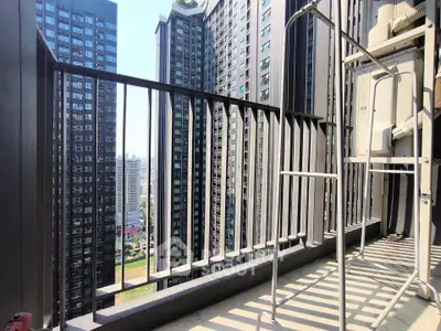 Modern high-rise balcony with cityscape view, perfect for urban living enthusiasts.