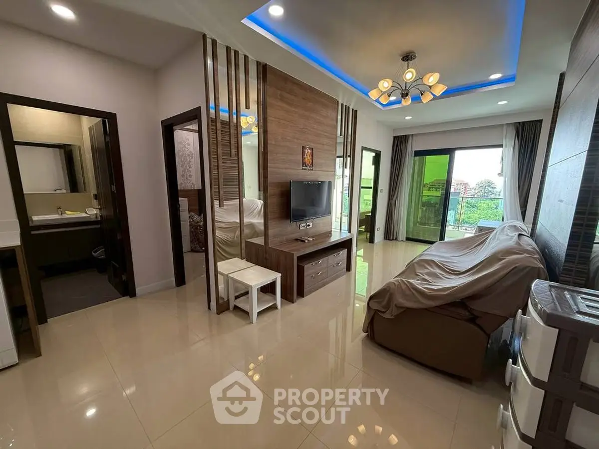 Modern living room with stylish lighting and balcony view