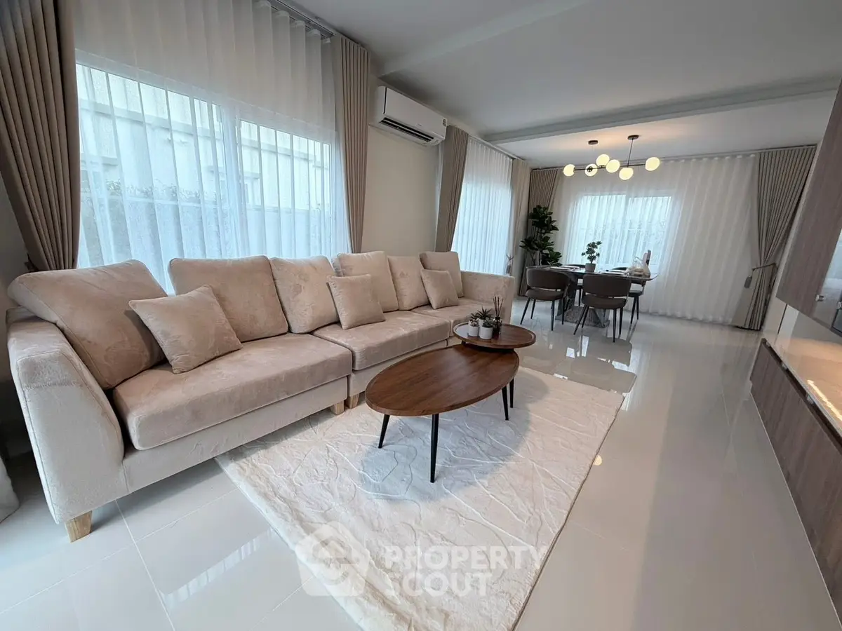 Spacious modern living room with elegant decor and natural light