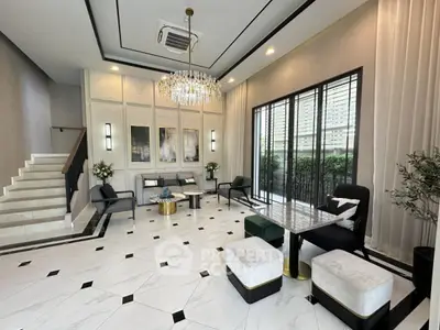 Luxurious living room with elegant chandelier and modern decor