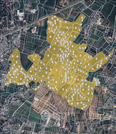 Aerial view of a large land plot with marked boundaries and development potential.