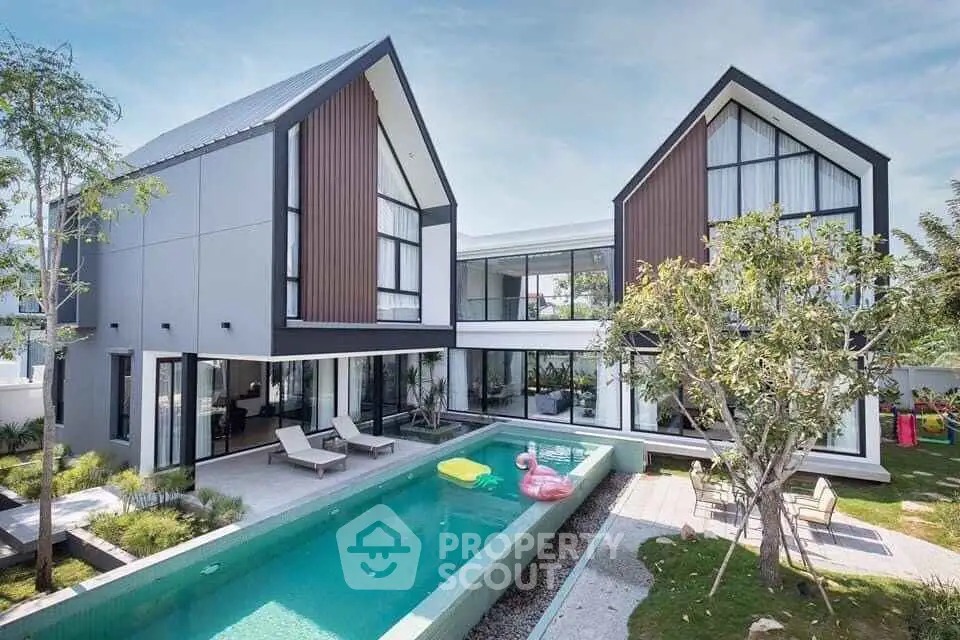 Stunning modern home with sleek architecture and luxurious pool, perfect for contemporary living.