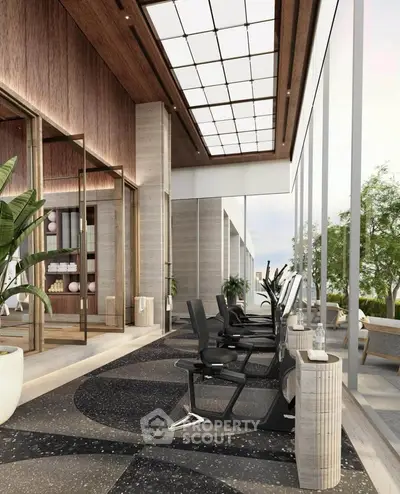 Luxurious modern gym with floor-to-ceiling windows and state-of-the-art equipment in a high-end residential building.