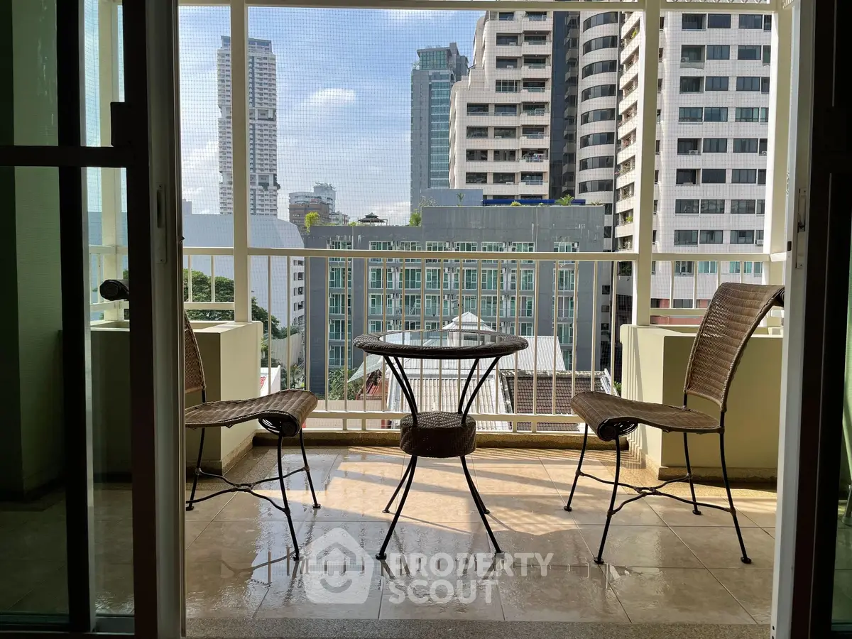 Charming balcony with city view, perfect for relaxation and enjoying urban skyline.