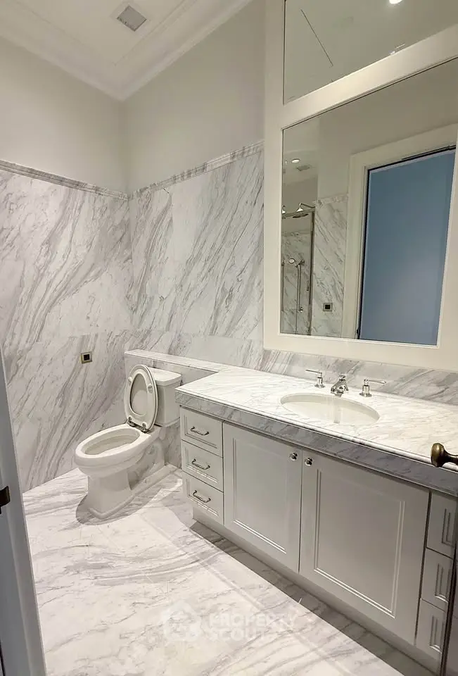 Luxurious marble bathroom with elegant vanity and modern fixtures