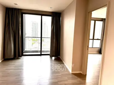 Spacious modern apartment with large windows and balcony view