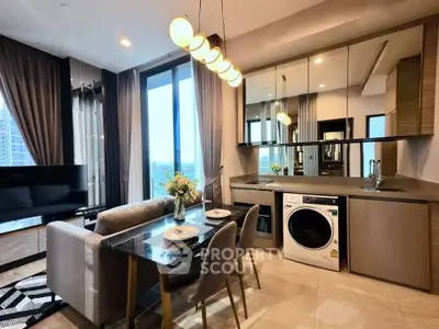 Modern living room with dining area and washer in stylish apartment