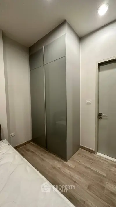 Modern bedroom with sleek wardrobe and minimalist design