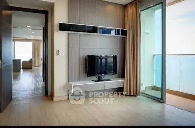 Modern living room with ocean view and sleek TV setup