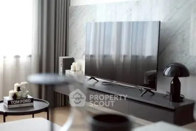 Modern living room with sleek TV and stylish decor