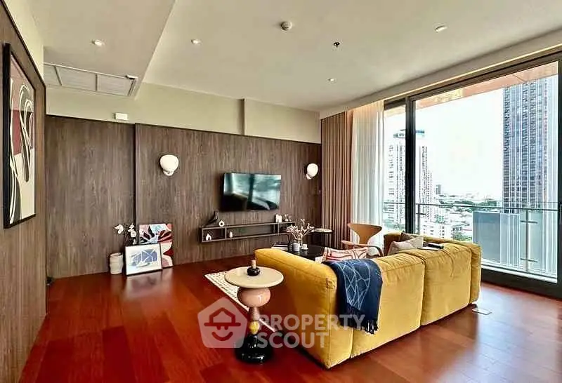 Luxurious living room with modern decor and stunning city view from large windows.