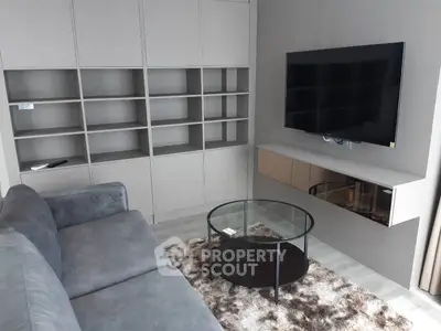 Modern living room with sleek shelving and wall-mounted TV