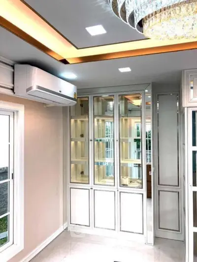 Luxurious living room with elegant cabinetry and modern lighting