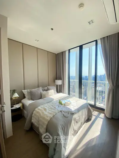 Luxurious bedroom with stunning city view and elegant decor