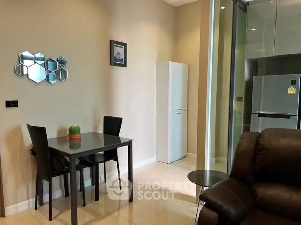 Modern living room with dining area and sleek kitchen appliances