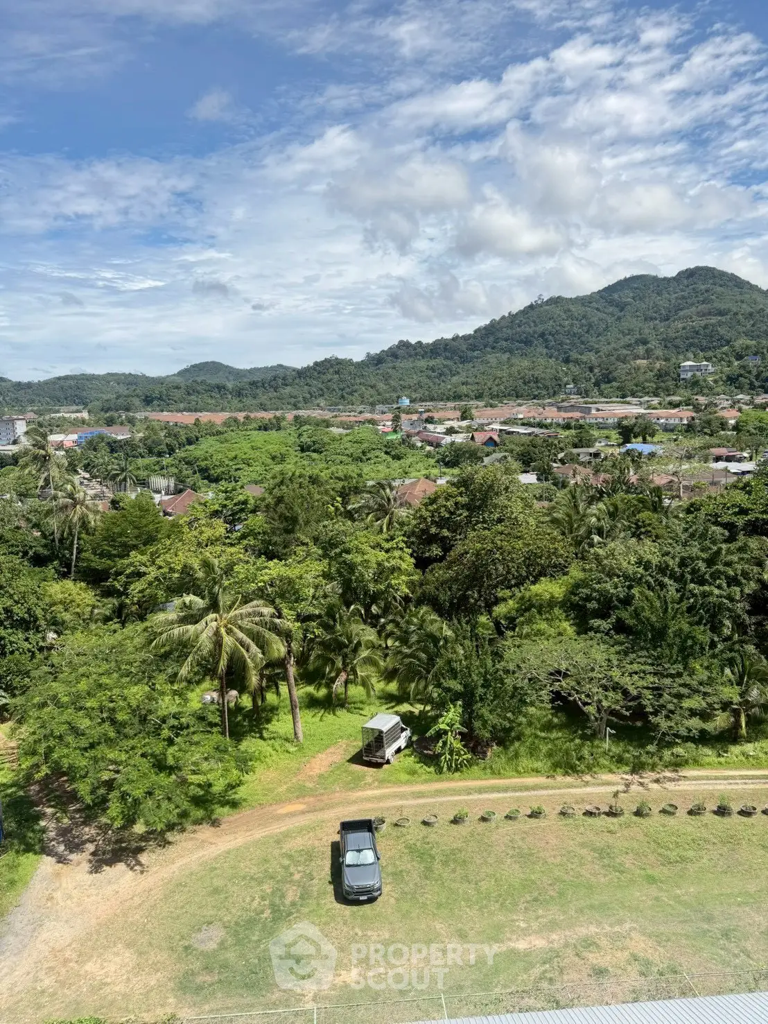 Scenic view of lush greenery and mountains from a high vantage point, perfect for nature lovers.