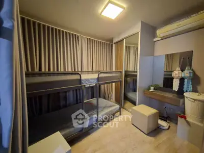 Cozy bedroom with bunk beds and mirrored closet in modern apartment