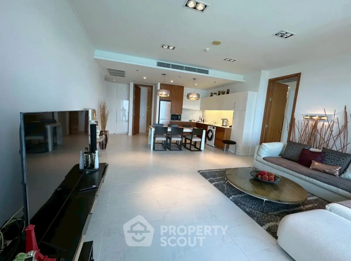 Spacious modern living room with open kitchen and stylish decor