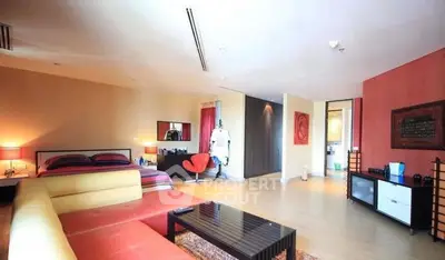 Spacious modern living room with vibrant decor and ample natural light