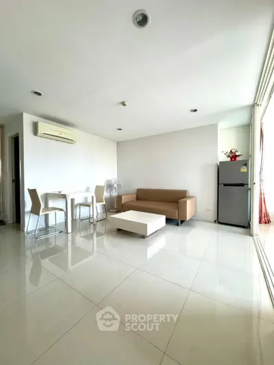 Spacious modern living room with sleek furniture and natural light