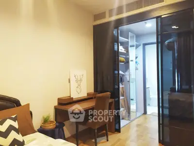 Modern bedroom with glass wardrobe and cozy workspace