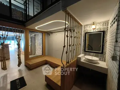 Modern interior with unique rope design and stylish lighting in a contemporary setting.