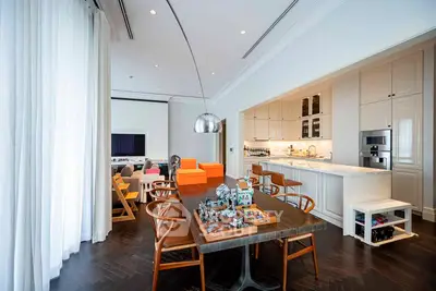 Spacious modern living room with open kitchen and elegant dining area