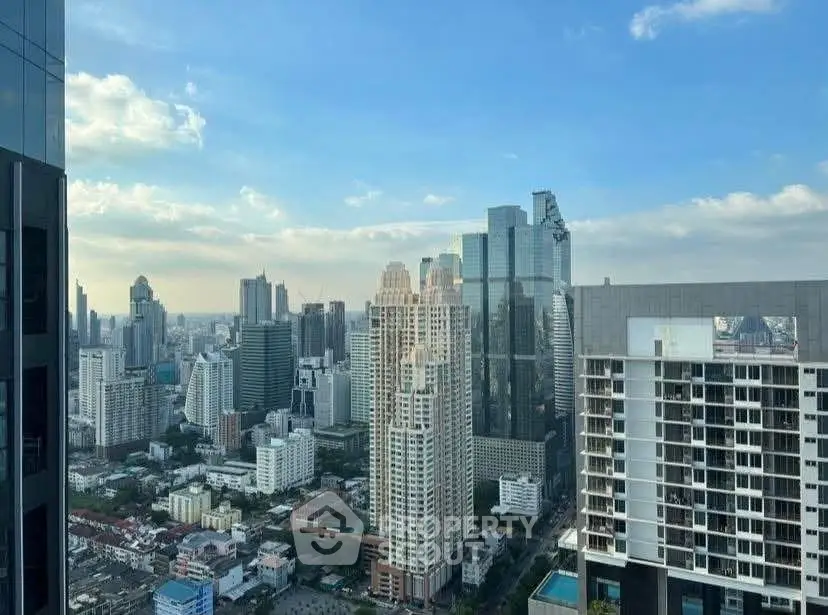 Stunning cityscape view from a high-rise building showcasing modern urban architecture and skyline.