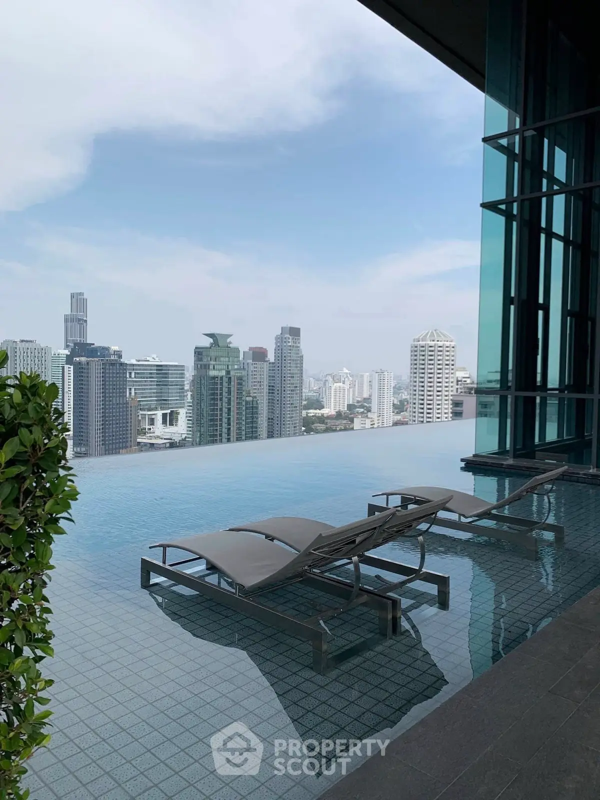 Luxurious rooftop infinity pool with stunning city skyline view
