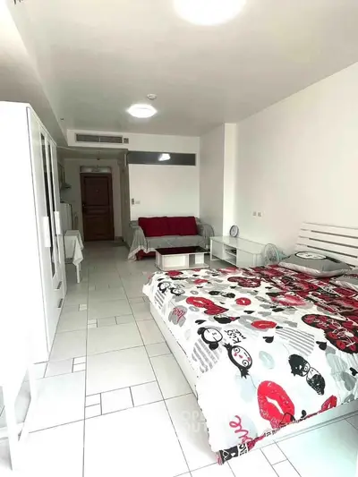 Spacious studio apartment with modern decor and ample natural light