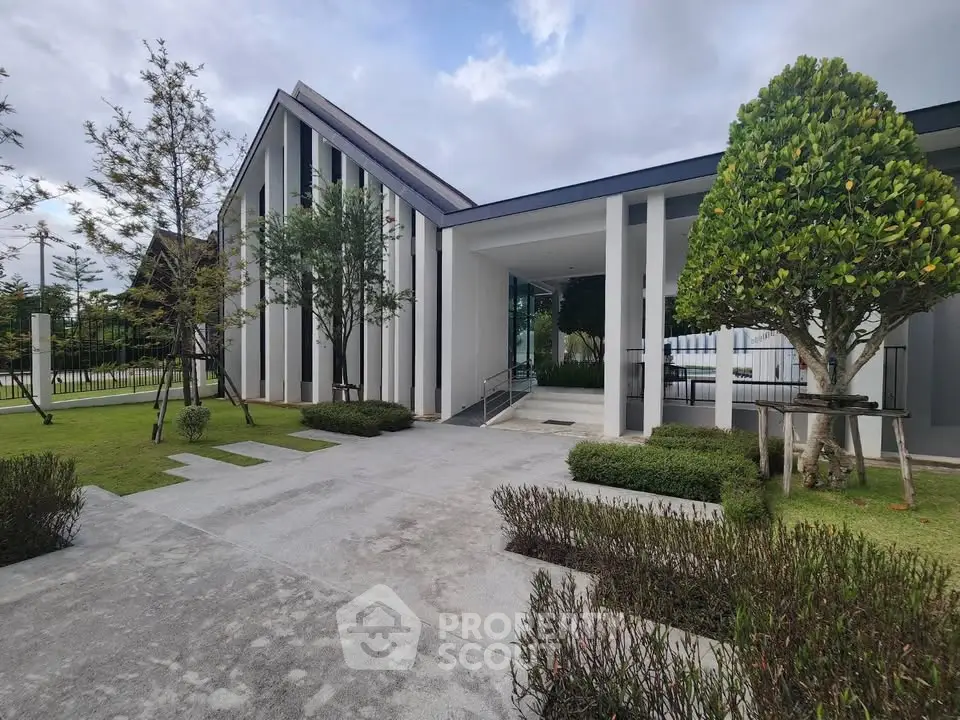 Modern architectural building with sleek design and lush landscaping