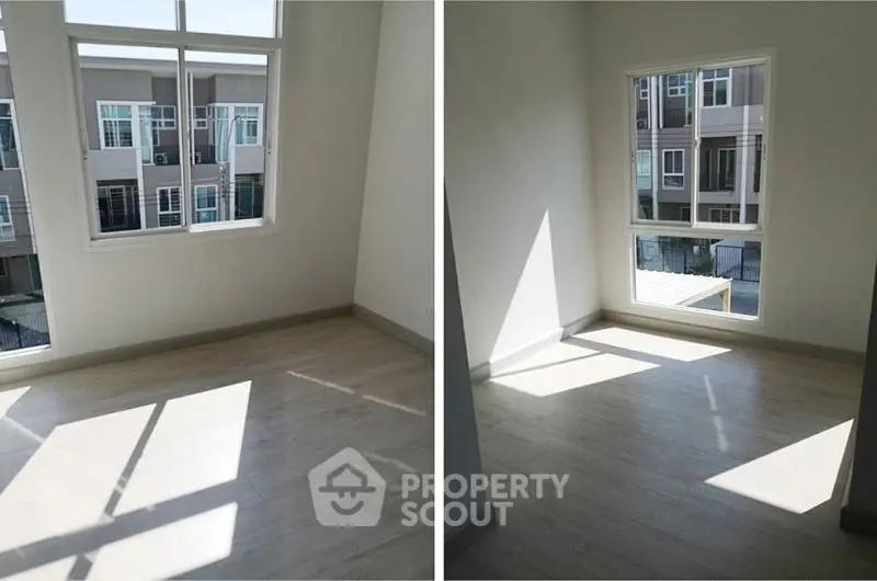 Bright empty room with large windows and wooden flooring, perfect for customization.