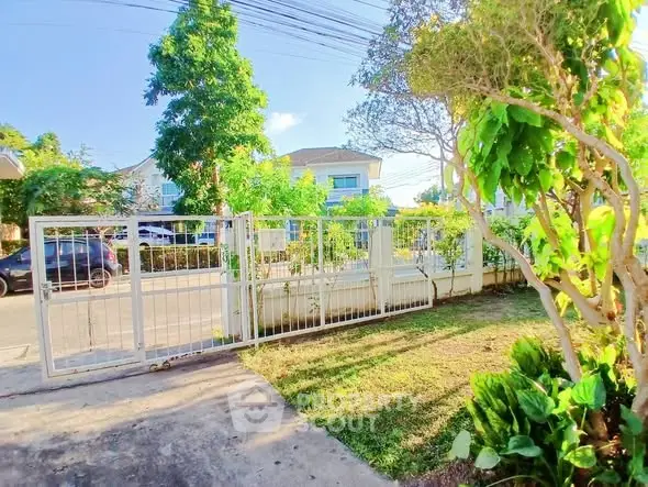 Charming suburban home with lush garden and secure gated entrance