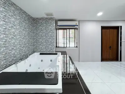 Luxurious bathroom with modern jacuzzi and sleek tile design