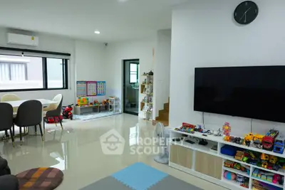 Spacious living room with modern decor and children's play area