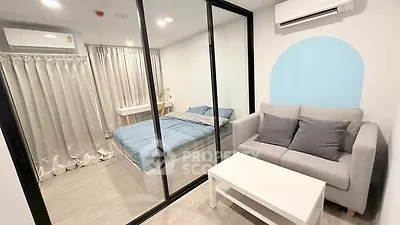 Modern studio apartment with glass partition and cozy furnishings