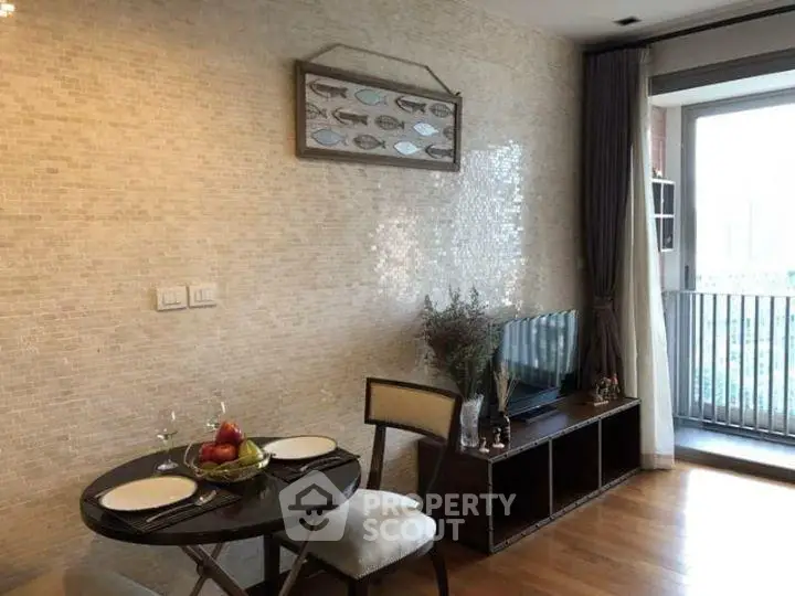 Charming living room with elegant decor and balcony access in modern apartment.