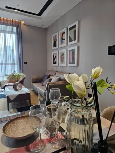 Stylish living room with modern decor and large windows for natural light