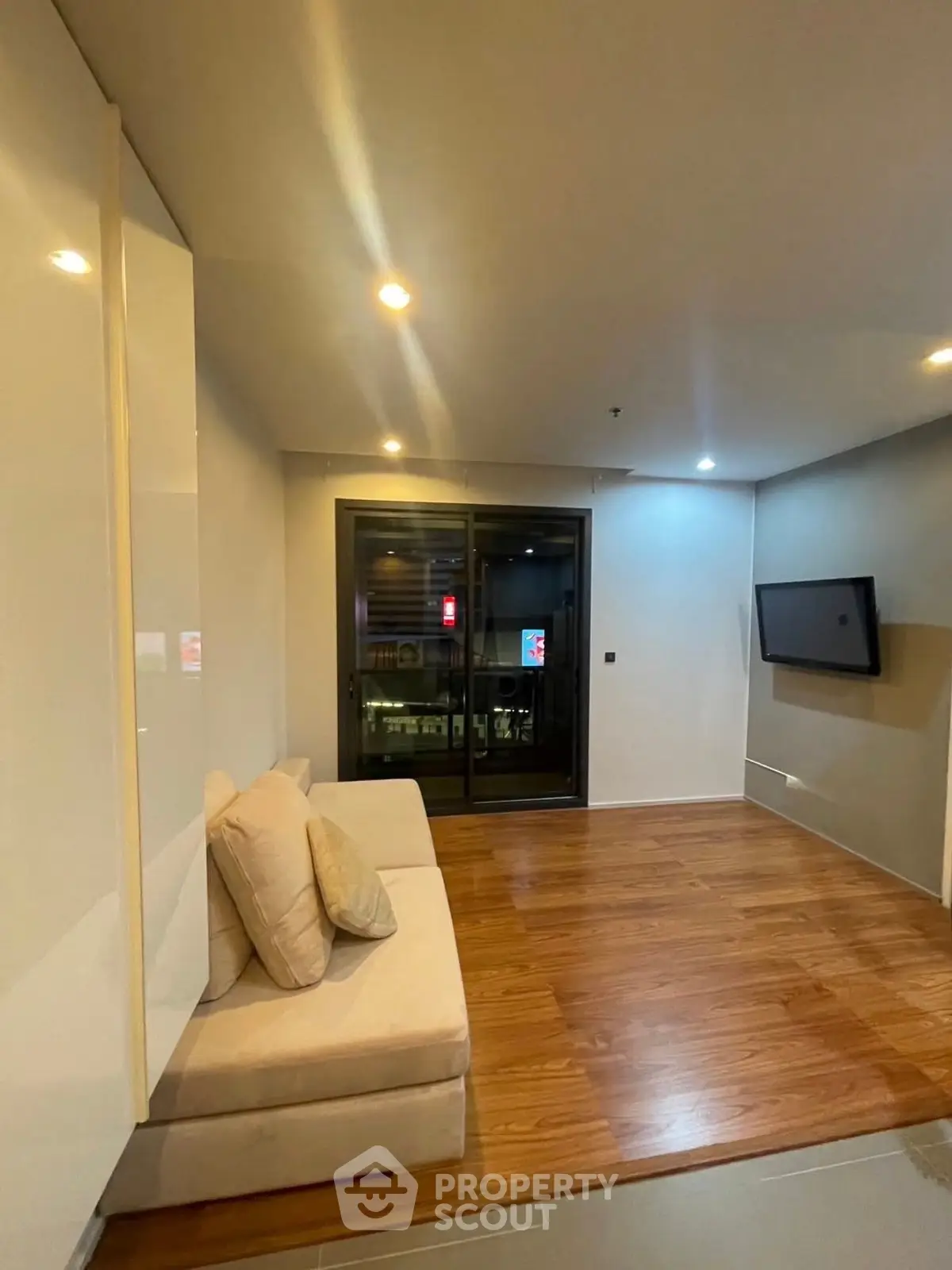 Modern living room with sleek design and wooden flooring