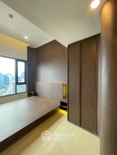 Modern bedroom with wooden paneling and city view, featuring sleek design and natural light.