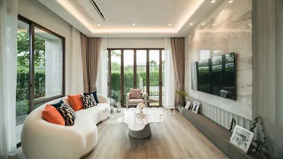 Luxurious modern living room with elegant decor and large windows overlooking a lush garden.