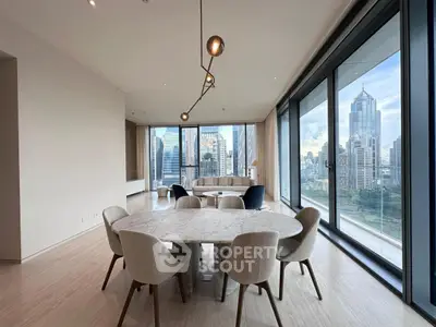 Luxurious dining area with stunning city view in modern high-rise apartment