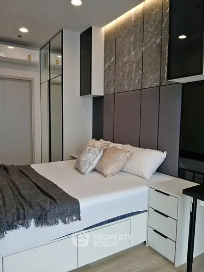 Modern bedroom with stylish decor and built-in storage solutions