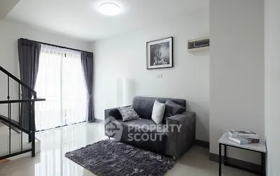 Modern living room with cozy gray sofa and elegant decor