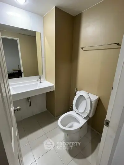 Modern bathroom with sleek fixtures and neutral tones, perfect for a minimalist design.