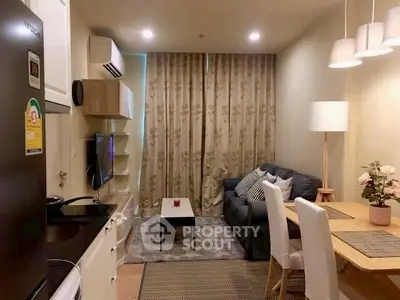 Cozy living room with modern decor and dining area, perfect for relaxation.