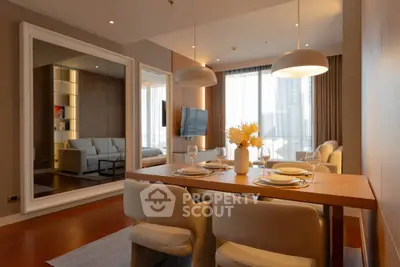 Elegant dining area with modern decor and cozy seating in a luxurious apartment.